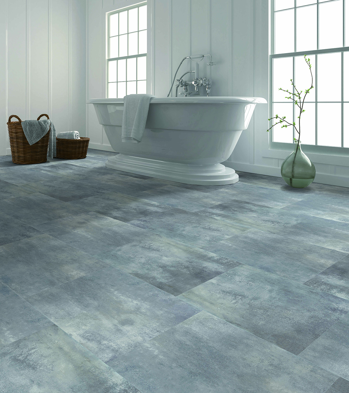 Gray/white LVT in bathroom with clawfoot white tub by large windows in the background.